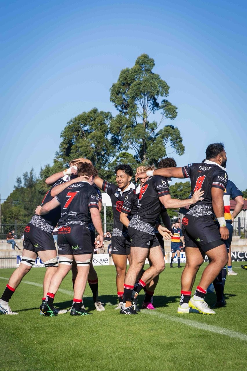 Teammates celebrate together on the field