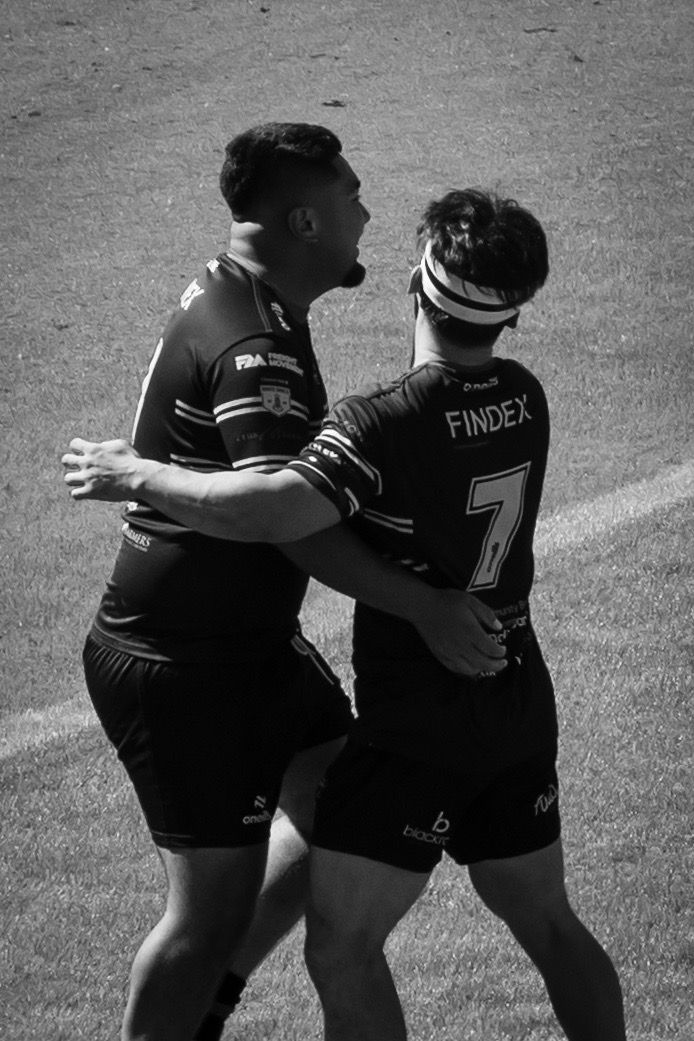 Two players embrace in celebration
