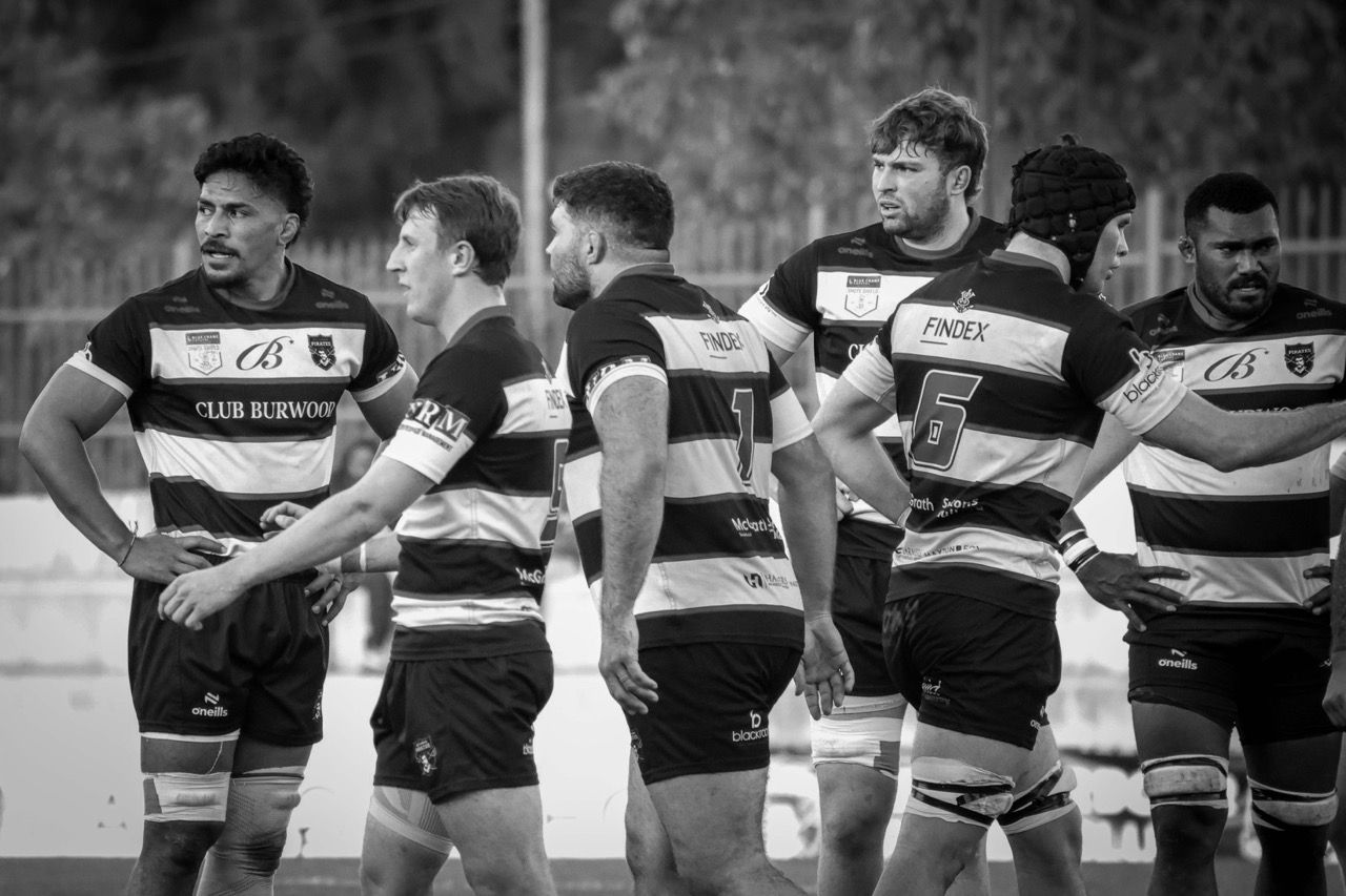 Forwards stand together waiting for the restart
