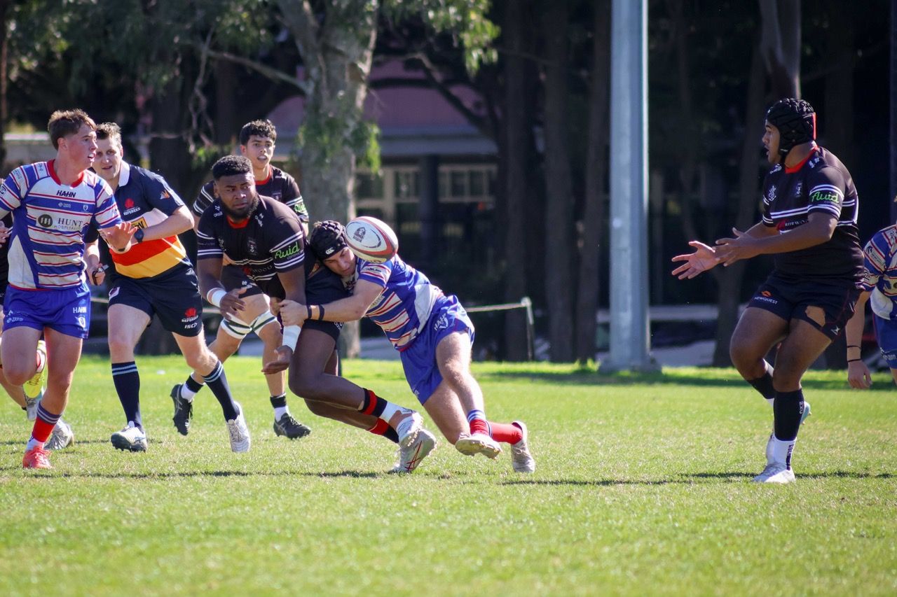 A Colts ball carrier is tackled as defenders close in