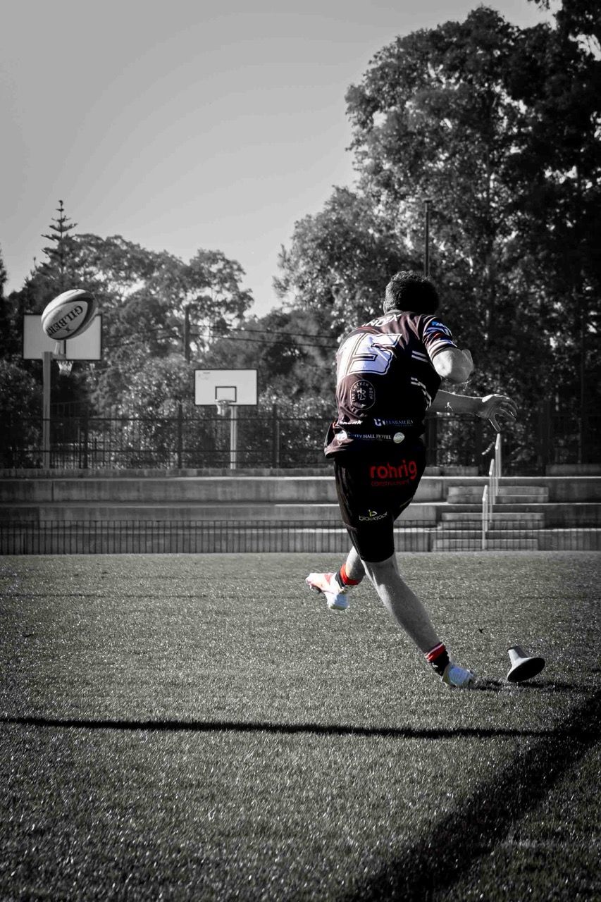 A player kicks the ball downfield